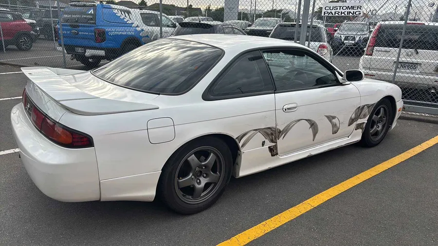 Collision-damaged Silvia with panel markings, rear three-quarter