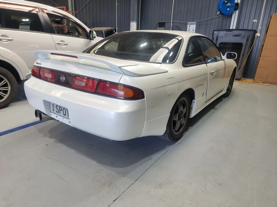 Refinished Silvia, rear three-quarter outside the workshop